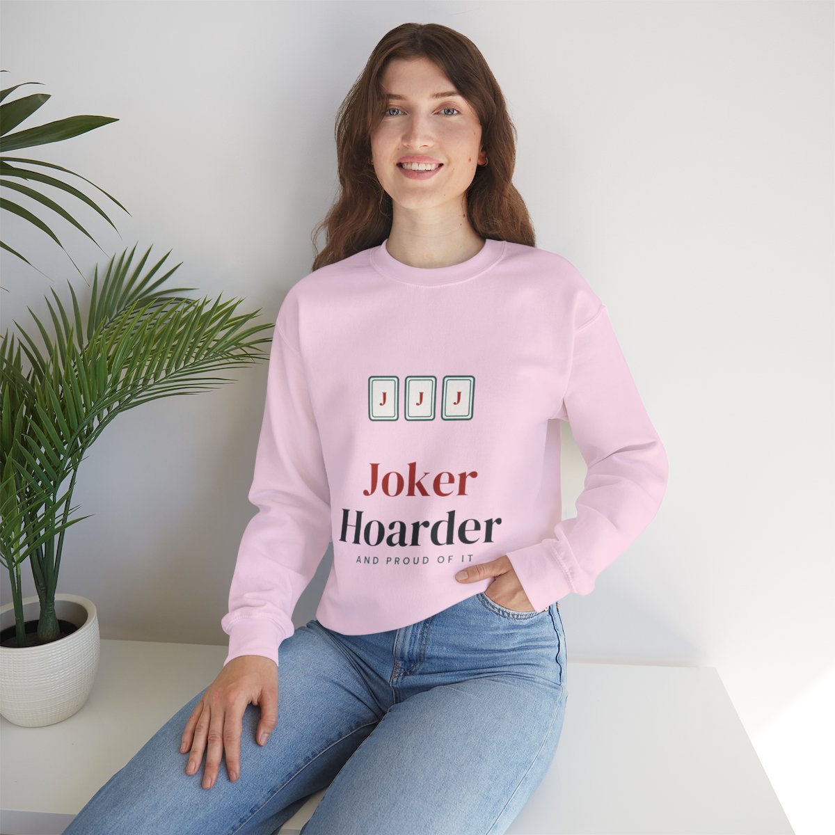 Joker Hoarder mahjong sweatshirt worn at home, shown in Light Pink