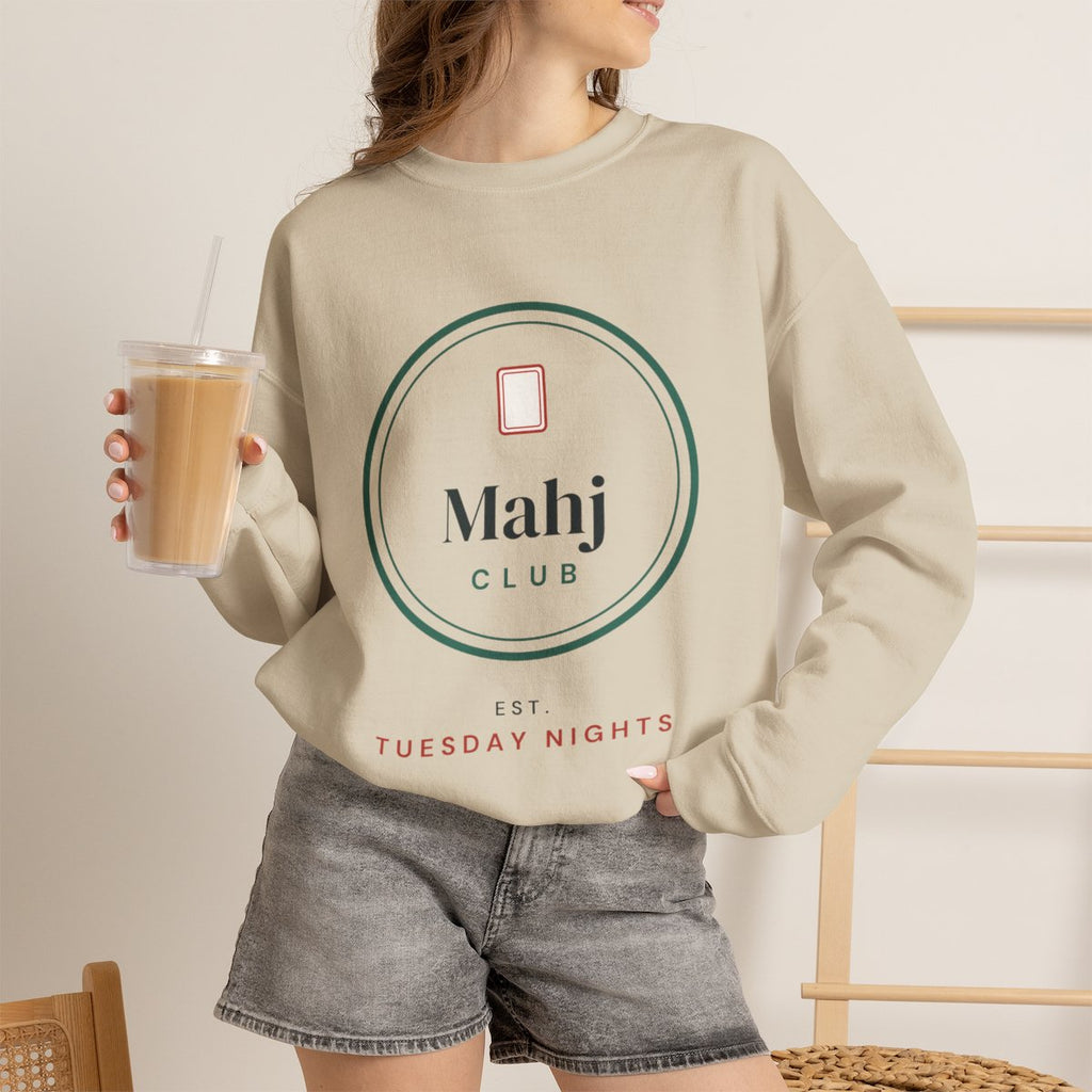 Mahj Club, Est. Tuesday Nights mahjong sweatshirt worn with iced coffee, shown in Sand