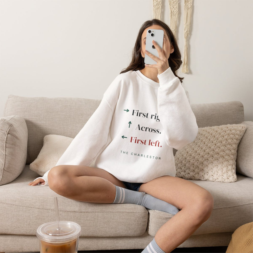 The Charleston mahjong sweatshirt worn on the sofa, shown in White